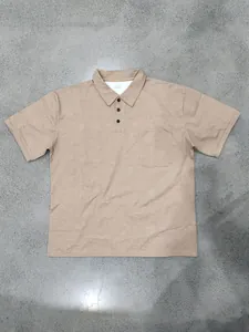 Close-up detail of a vintage khaki men's lapel Polo shirt with chest pocket on floor