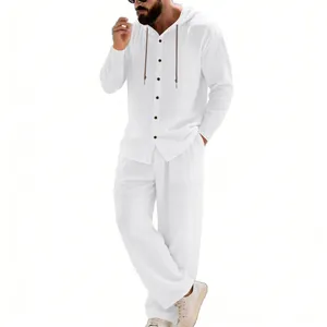 Detail view of men's white linen hooded shirt and straight pants set for beach vacation