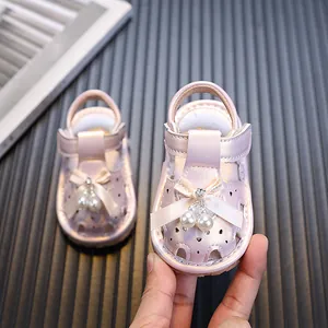 Elegantes sandalias rosa para bebé niña con lazo y perlas para aprender a caminar