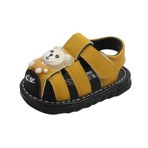 Yellow summer sandals for baby boys featuring a cute cartoon bear and soft anti-slip sole