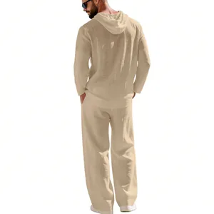 Back view of men's beige linen hooded shirt and straight pants for beach vacation
