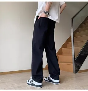Detailed side-back view of men's loose straight-leg black high-street denim jeans for summer