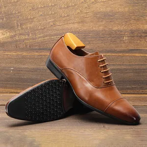 Close-up of classic brown leather oxford shoes with cap toe and textured black sole