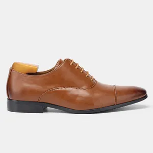 Side profile of a classic brown leather Oxford shoe with cap toe and wooden tree