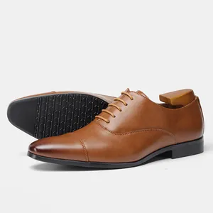 Detailed side view and non-slip sole of classic brown leather Oxford dress shoes