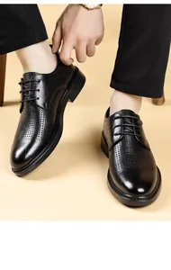 Close-up of men's black breathable leather derby shoes with perforated details for formal wear