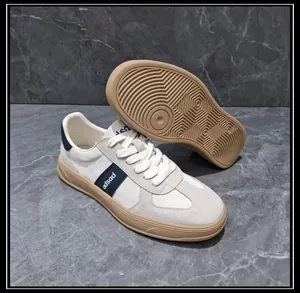 Close-up of men's leather and fabric casual German Army Trainer sneakers with gum sole