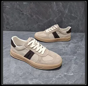 Detailed close-up of beige leather and fabric patchwork GAT sneakers for men, stylish design
