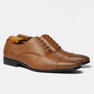 Classic men's brown Oxford formal leather shoes with wooden shoe trees