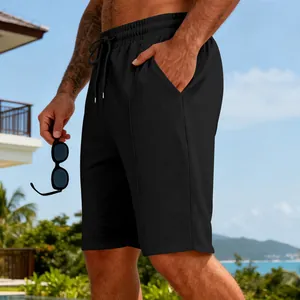 Short de sport décontracté pour homme en maille gaufrée noire avec cordon.