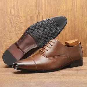 Detailed view of brown Oxford shoes with non-slip sole and vintage cap-toe design