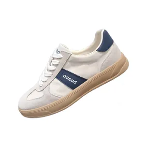 Men's leather and fabric sneakers, German Army Trainer style with navy accents and gum sole.