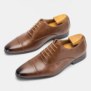 Angled view of classic brown leather business Oxford shoes for men with wooden shoe trees