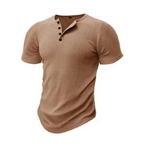 Close-up of ribbed texture and button placket on men's tan short sleeve Henley shirt