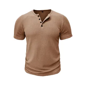 Close-up detail of a men's brown ribbed short sleeve Henley t-shirt with buttons