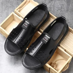 Detail view of black breathable hollow-out men's summer beach sandals in wooden box