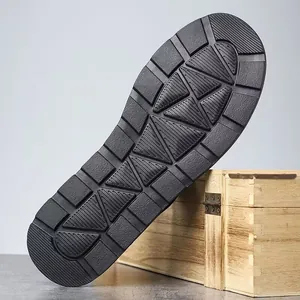 Detail view of the durable black anti-slip rubber sole on men's Roman beach sandals