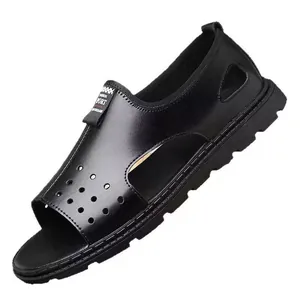 Macro detail of black men's hollow-out breathable beach sandals with textured sole