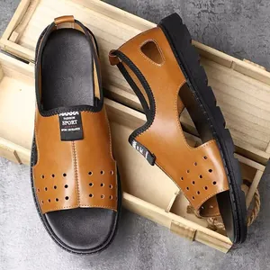 Close-up detail of men's brown leather Roman beach sandals with hollow breathable design