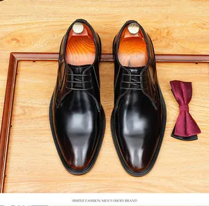 Top down macro view of elegant black oxhide leather business dress shoes for men