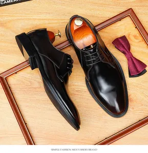 Detailed top-down shot of polished black leather oxford shoes within an elegant display frame