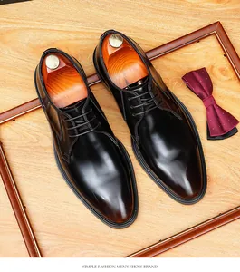 Macro view of burnished leather men's business shoes with laces and wooden trees