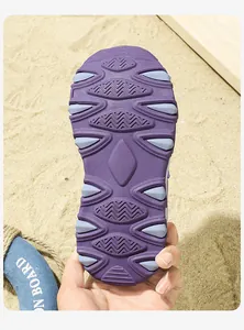 Close-up view of durable anti-slip purple rubber sole for kids sports beach sandals