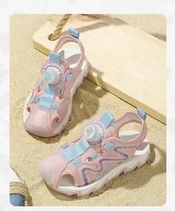 Close-up of pink children's sandals featuring a convenient rotary dial lace system.