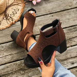 Detailed view of brown hollow-out platform sandals with block heel and back zipper
