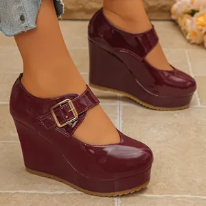 Elegant wine red patent leather Mary Jane wedge heels with platform and golden buckle strap
