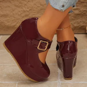Side view of wine red patent leather platform wedge Mary Jane shoes with gold buckle strap