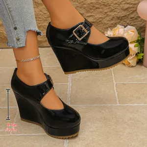 Close-up of black patent leather Mary Jane wedge heels with 3.9-inch platform