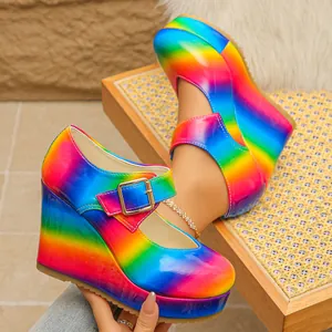 Detail shot of rainbow platform wedge Mary Jane shoes with vibrant gradient finish.