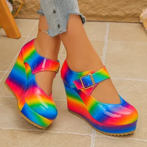 Side view of vibrant rainbow gradient wedge Mary Jane shoes with platform soles