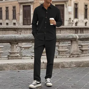 Men's casual black corduroy two-piece set featuring long-sleeve shirt and matching pants.