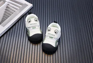 Detail view of breathable mesh toddler shoes with cute green cartoon duck ear design.
