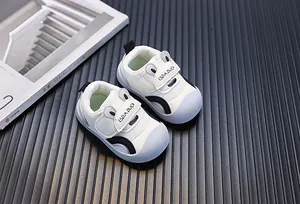 Detail view of breathable white baby walking shoes with cute bunny ear design on soft mesh.