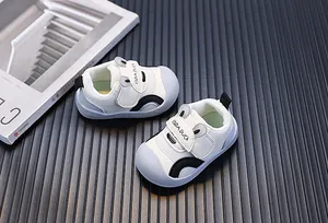 Close-up detail of white breathable mesh toddler walking shoes with a cute ear design
