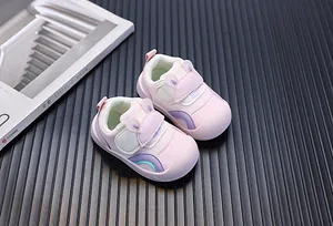 Close-up of pink toddler sneakers featuring cute rabbit ear straps and breathable mesh fabric.