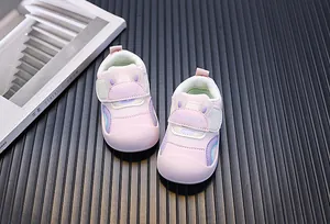 Detail view of pink baby walking shoes with breathable mesh and cute bunny ears