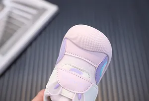 Close-up of pink mesh toddler shoe with bunny ear design and protective rubber toe cap
