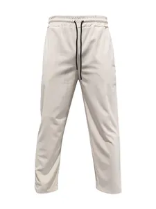 Detailed view of men's beige corduroy trousers with elastic drawstring waist design
