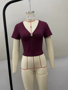 Maroon V-neck slim fit short sleeve top with gold metal buckle detail on a mannequin