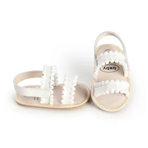 Weiße Baby-Lauflernsandalen mit süßem Pompon-Besatz und Klettverschlussriemen