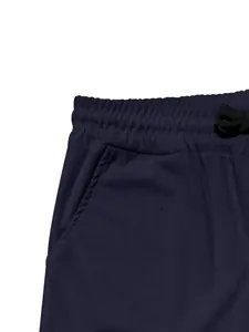 Close-up of men's navy blue corduroy pants with elastic waist and drawstring