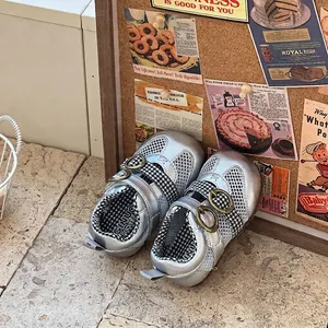 Detail view of silver breathable mesh baby walking shoes featuring stylish gingham straps