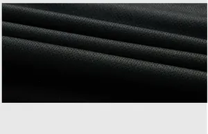 Macro detail of high-performance breathable black mesh fabric used in sports T-shirts