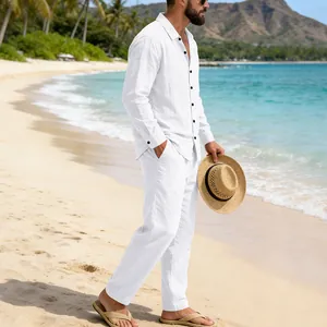 Detailed view of men's white linen beach set with long-sleeve shirt and straight pants.