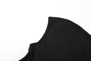 Close-up detail of the neckline and stitching on a black slim-fit bodycon dress