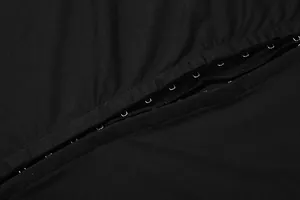 Detailed view of metal hook-and-eye fasteners on a sexy black slim fit bodycon dress